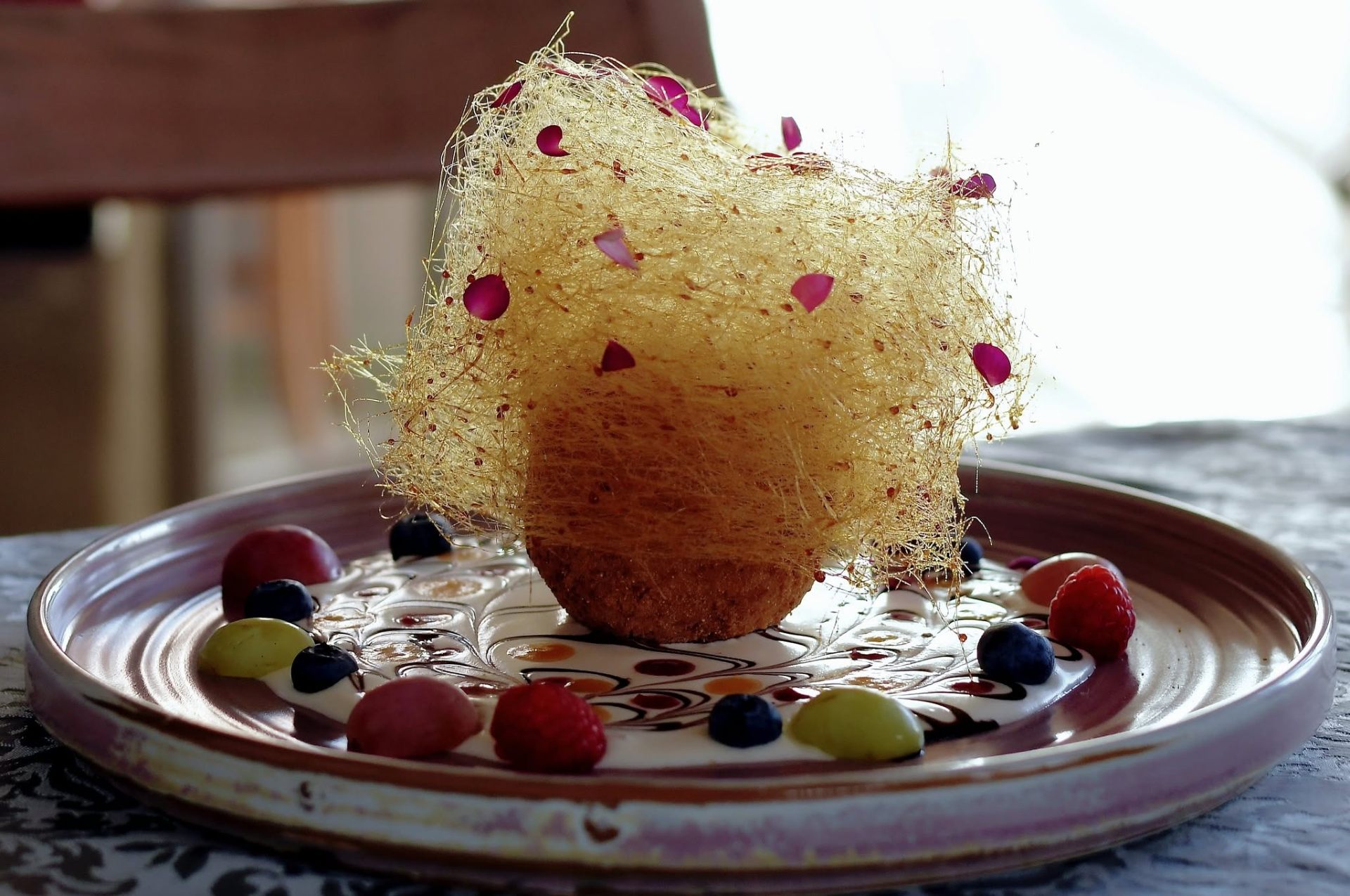 Dessert with caramel thread and fruits